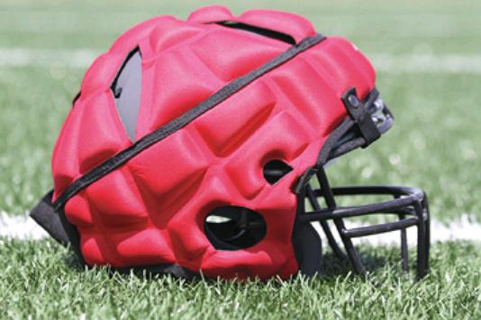 The Guardian Cap, which comes in a variety of colors, has caught on in many schools during practices, but not in games.
