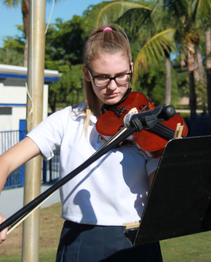 Eighth grader Eva Hasenhuttl-Bishop plays "Amazing Grace" on the violin.