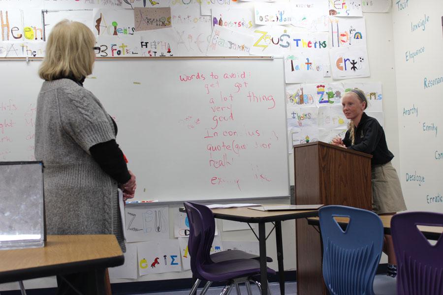 Eighth grader Madison Lichtig is given a word to spell by Mrs. Devine yesterday. Lichtig qualified for the school finals next week.