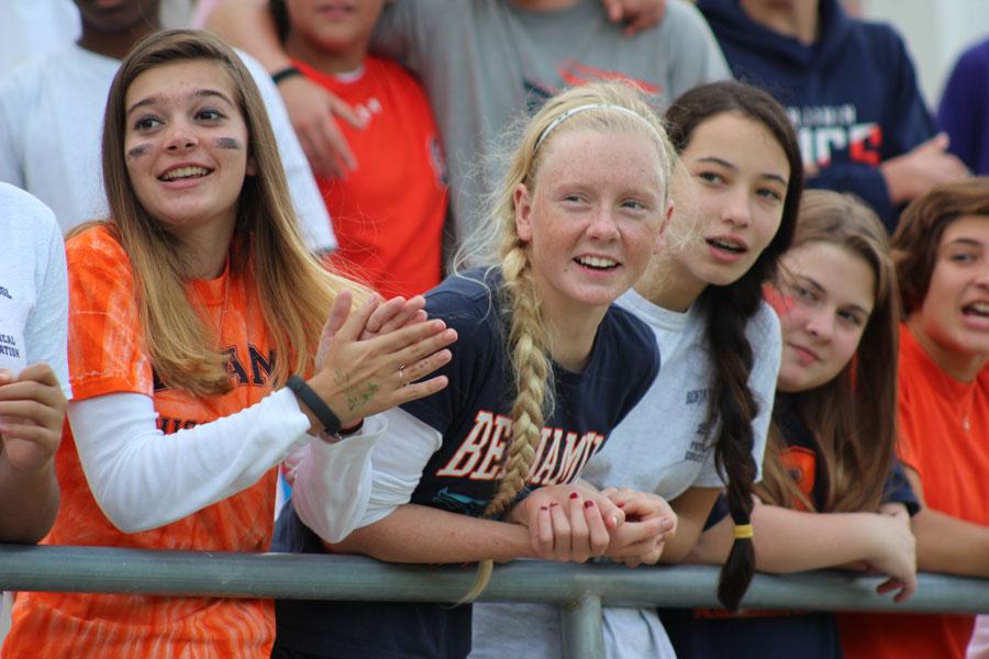 Left to right: Eighth graders Alina Pimentel, Madison Lichtig, and Samantha Sweeney cheer on their classmates during the soccer match.