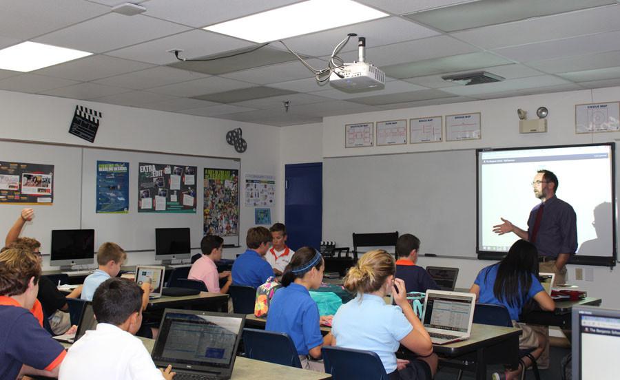 Mr.+Crisafi+gives+students+instruction+on+how+to+customize+their+NetClassroom+pages+after+school+on+August+25%2C+2015.