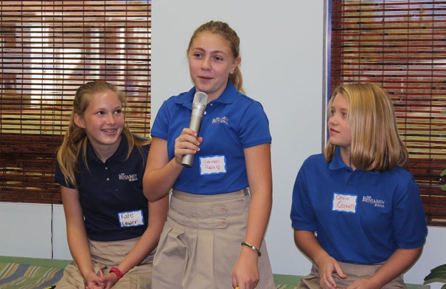 Seventh grader Lauren Papa answers a question posed by one of the ADL trainers while classmates Kate Lower (left) and Olivia Cornett look on.