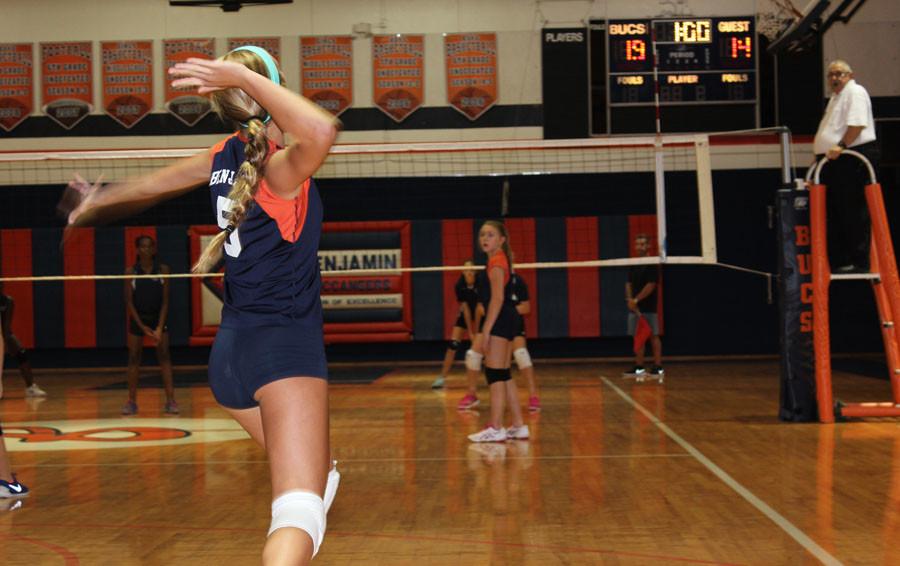 Eighth grader Chloe Jezerinac prepares to blast a serve during the teams game against 