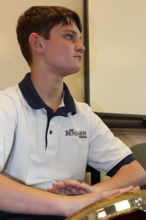 Eighth grader Justin Stohlman wears one of the two-toned polos during Fine Arts Day on September 25, 2015.