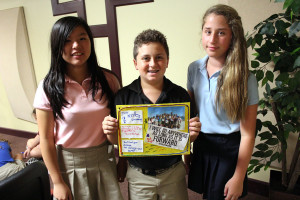 Left to right: sixth graders Teresa Tuong, Spencer Cohen, and Sydney Steinger display their finished felt piece.