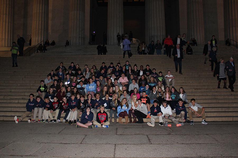 The entire eighth grade class takes a picture in front of the Lincoln Memorial. 