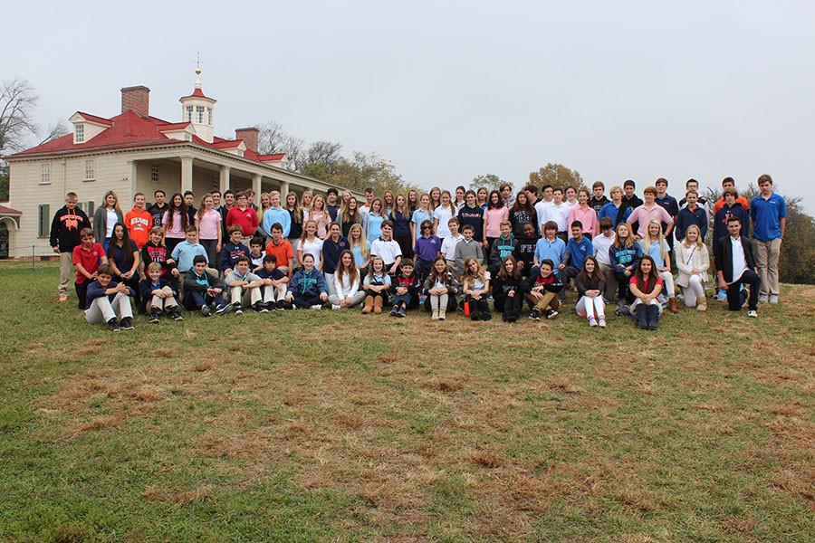 The entire eighth grade class poses in front of Mount Vernon