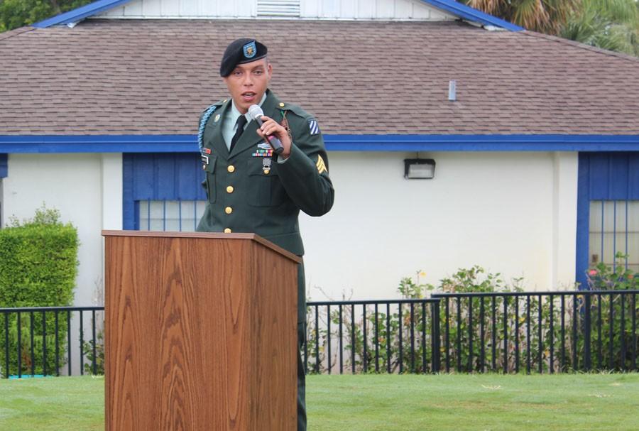 Featured speaker Mr. Marc Washington, dressed in his army uniform, addresses the crowd on Kennerly Field.