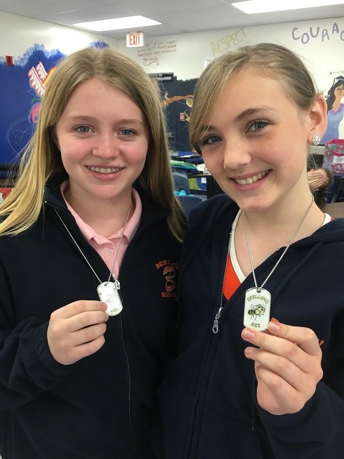 Seventh graders Briley Crisafi (right) and  Olivia Cornett display their medals.