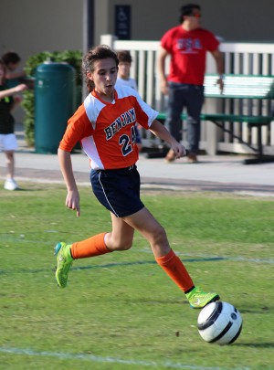 Seventh grader Emma Shirzad takes the ball downfield during the first half of the championship match.