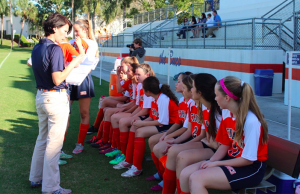 Mrs. Ponchock addresses the team prior to the team's semi-final game against St. Mark's. The Bucs won 8-0.