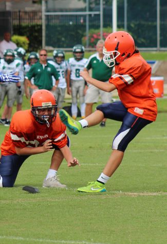 Emma Shirzad, with Will Mahon as the holder, attempts an extra point against Pine Crest Fort Lauderdale on September 6.
