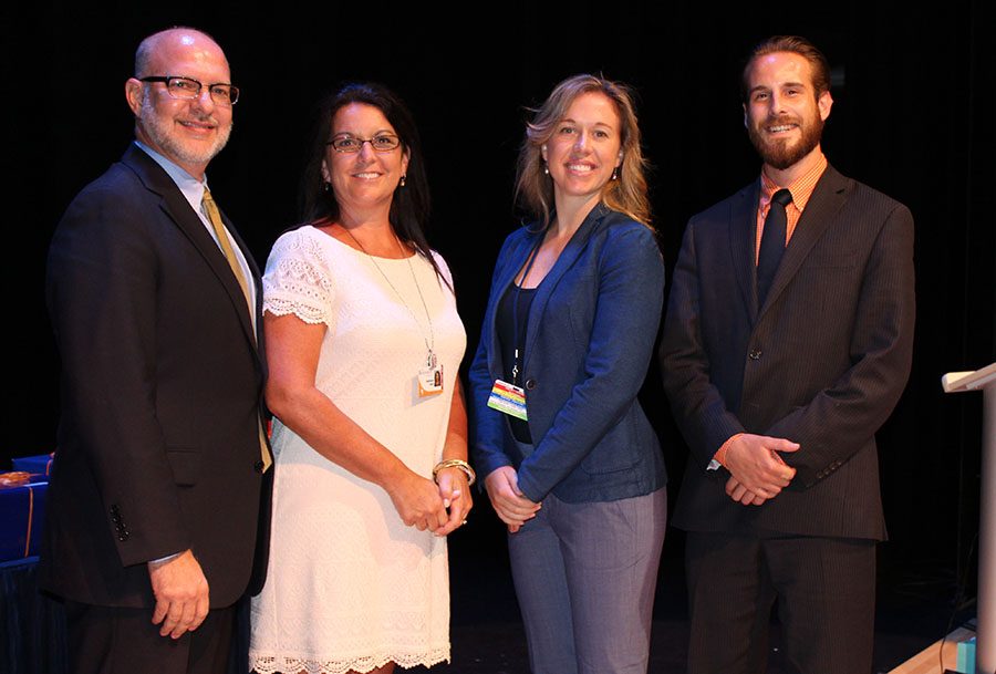 Mr. Hagy stands with (left to right) Mrs. Oster, Ms. Featherston, and Mr. Ginnetty after the new teachers were introduced to their colleagues in Benjamin Hall on August 11.