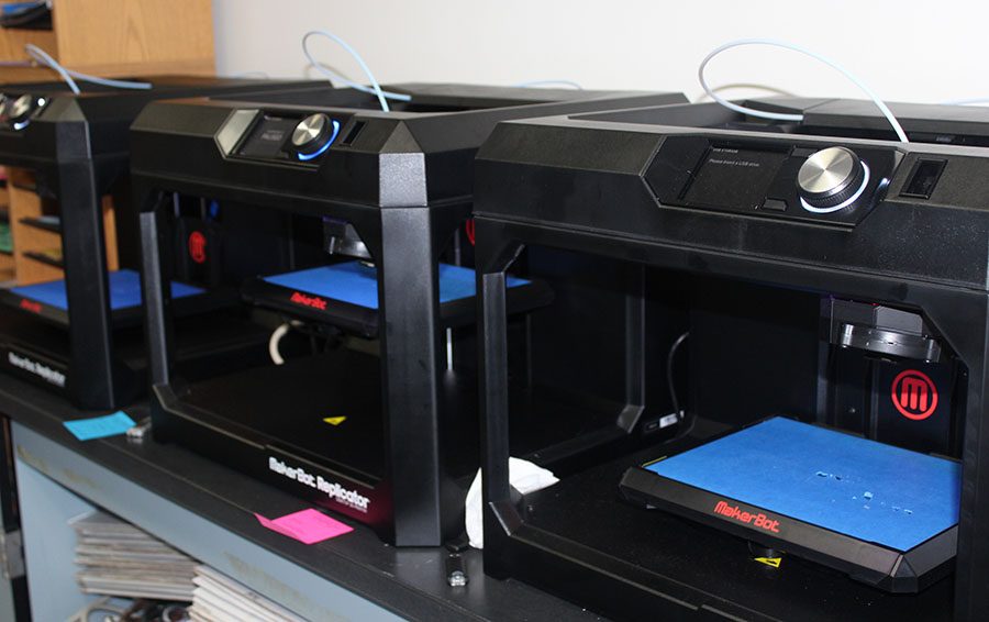 The three MakerBots line the wall of Ms. St. Martins back room. 
