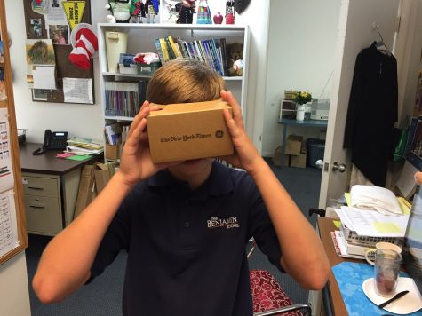 Seventh-grade Neersyde reporter Matthew Smith tries out the NYT VR goggles in Mrs. DUncan's office.
