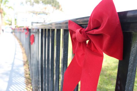 Red ribbons line the fence separating the quad from the Kennerly Field.