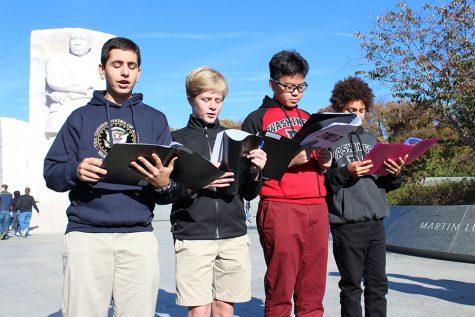 Left to right: Eighth graders Alex Michelon, Carter Stewart, Steven Gu, and Garison Gelman read their poem based on MLK, Jr.'s "I Have a Dream" speech in front ofthe civil rights leader's memorial.