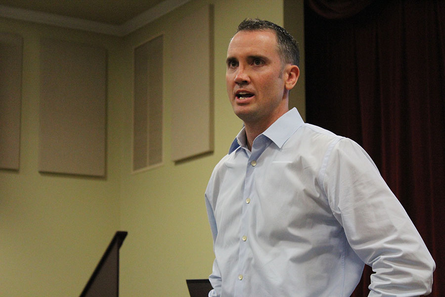In the BPAC, Mr. John McClellan '95 speaks to the Middle School about his high school days.