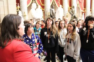 Eighth-grade students listen to their tour guide during their visit to the U.S. Capitol.