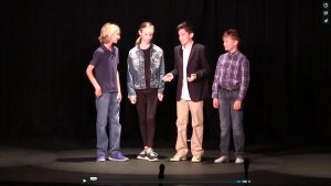 Left to right: Colby German, Katia Orsic, Luke Casper, and Jonathan Skatoff portray The Beatles during one of the skits.