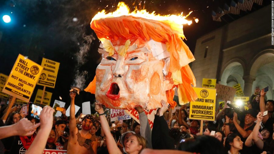 Protesters set fire to an effigy of President-Elect Trump outside Los Angles City Hall the day after the election.