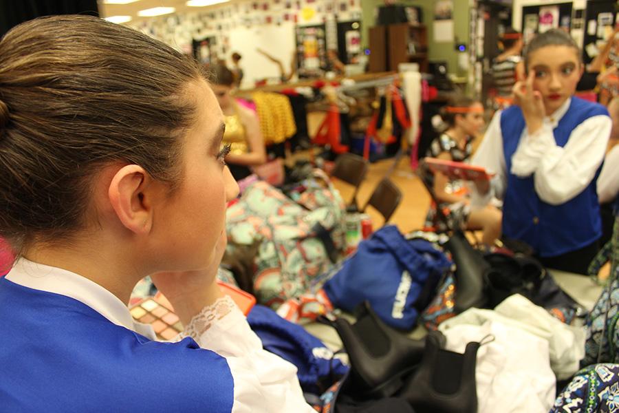 Eighth grader Chloe Habib gets ready backstage for the