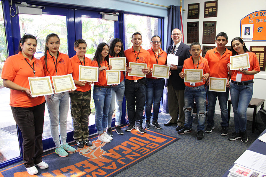 Head of Middle School Mr. Charles Hagy stands with the South American visitors. Hagy presented them with certificates for participating in a cultural immersion event. 
