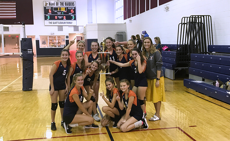 The Bucs pose with their hard-earned trophy after beating St. Mark's at Rosarian Academy on October 12, 2017.