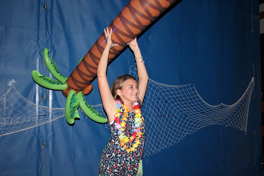 With so few people to dance with, seventh grader Samantha Treadwell resorts to partnering with a palm tree.