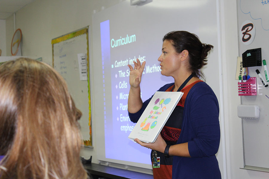 Sixth-grade science teacher Mrs. Mandy Sukhu talks to parents about her science curriculum. 