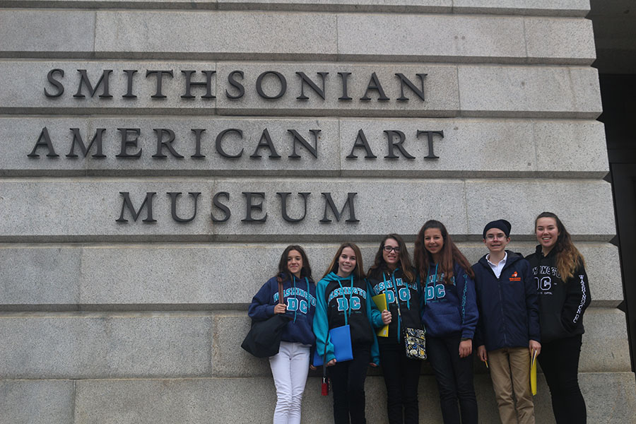 Eighth graders Amelia Porges, Catherine Schenk, Kiley Malmberg, Ella Pierman, Jakob Kroll, and Demi den Bakker pose in front of the Smithsonian American Art Museum on Wednesday, November 8.
