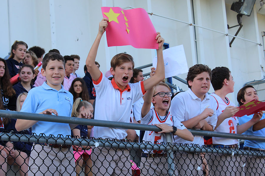Sixth graders Arthur Wolff, J.P. Jacobs, Sam Storch, and Tim Mahon cheer for China and the other participants  in the Lower School Olympics.