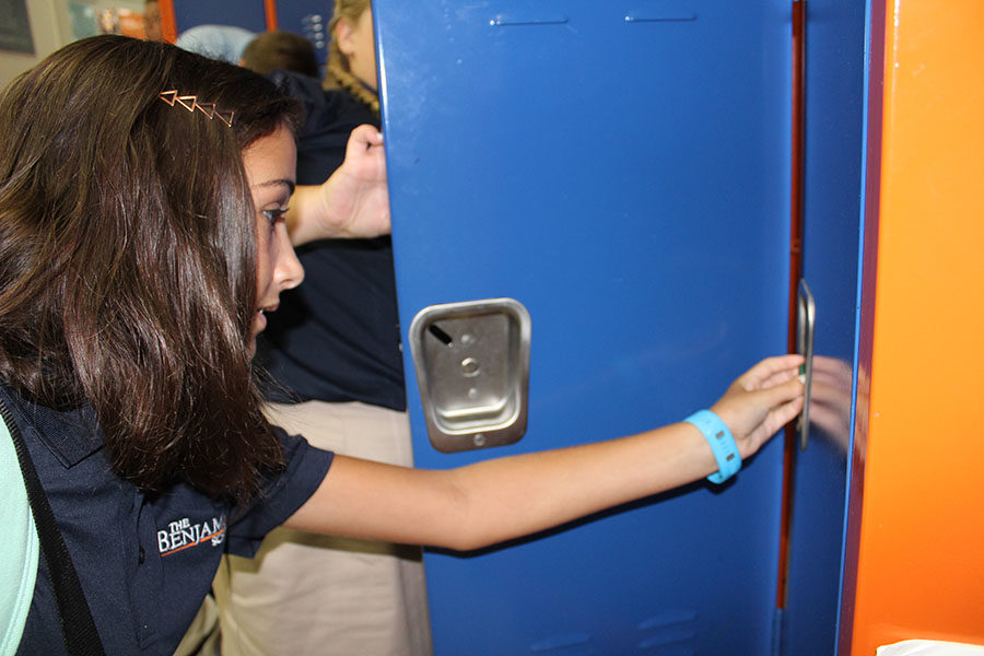 Sixth grader Athena Lekkas gets used to opening her locker on the first day of school. Lekkas enjoys sixth grade thus far, especially having the opportunity to play volleyball.