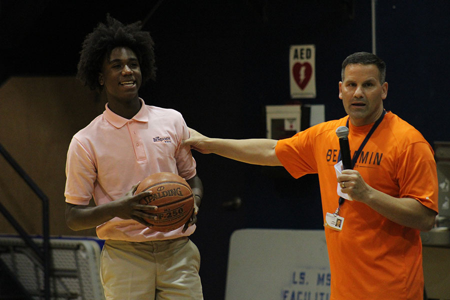 Mr. Cavallo introduces eighth grader Marvel Allen to the middle school student body at the beginning of the pep rally on August 16, 2018.