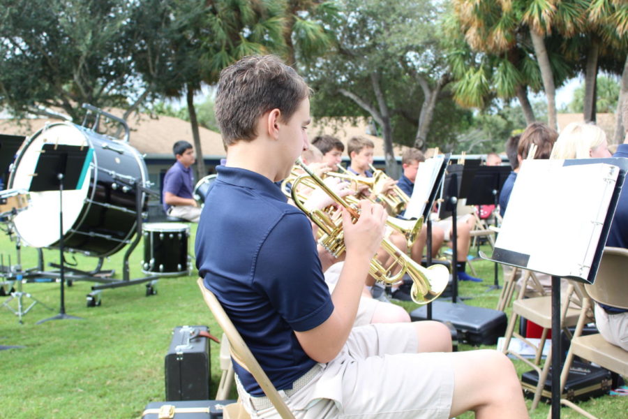 Seventh grade student, Shane Giaimo, plays the trumpet on Veterans Day.