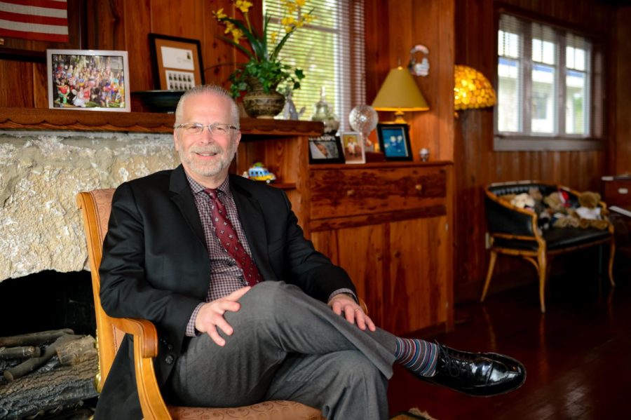 Mr. Goldberg poses in his office in the bungalow on the Lower/Middle School Campus.