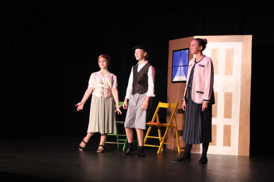 The Paroo Family, portrayed by Sarah Darby, Natalie Cona, and Samantha Treadwell, share the stage during the Gary, Indiana number.