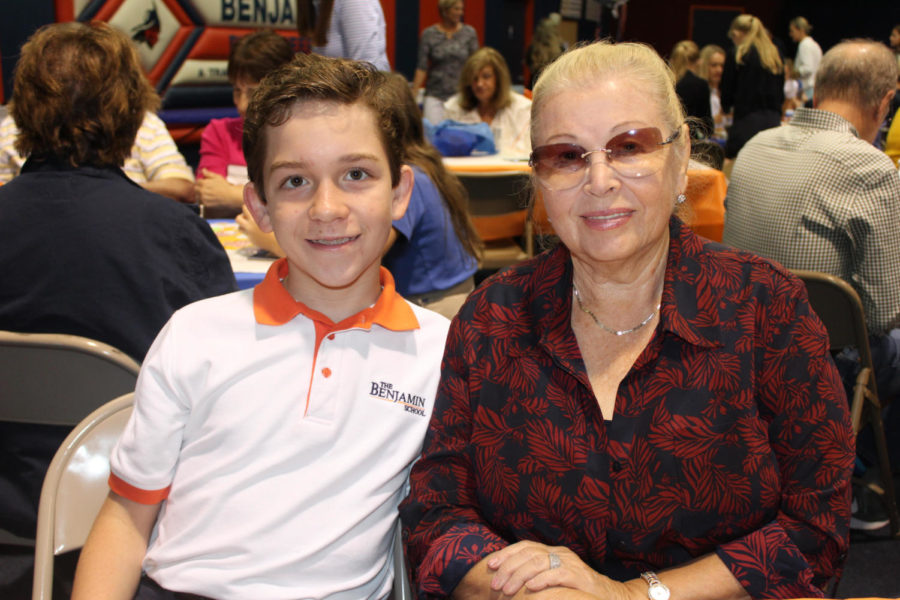 Sixth
grader Dany Lovas
poses with his
grandmother, Ms.
Mila Zharmenova, in the gym.