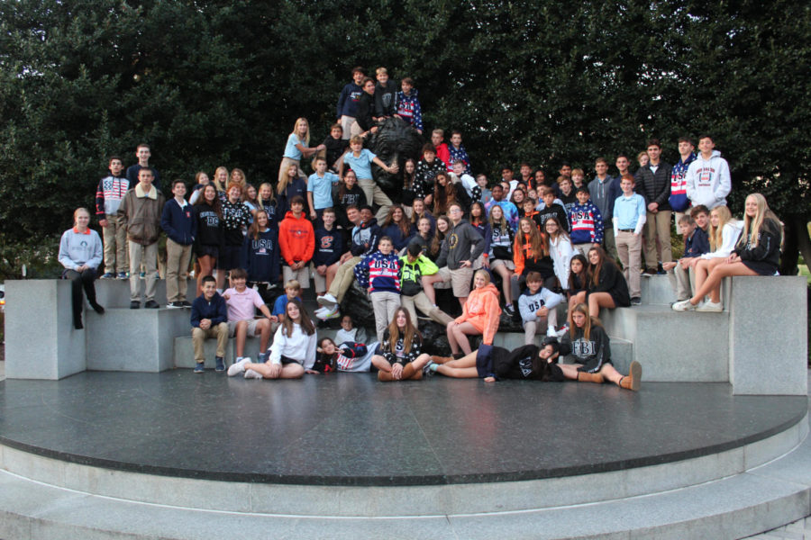 The eighth-grade poses in front of famous scientist Albert einstein.