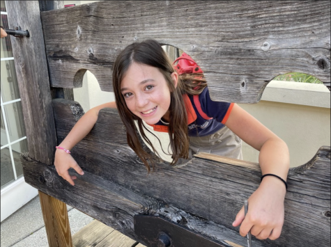 Students loved visiting the pirate museum! While there they saw a pillory and sixth grader, Maddie Lemanski poses for a picture. 