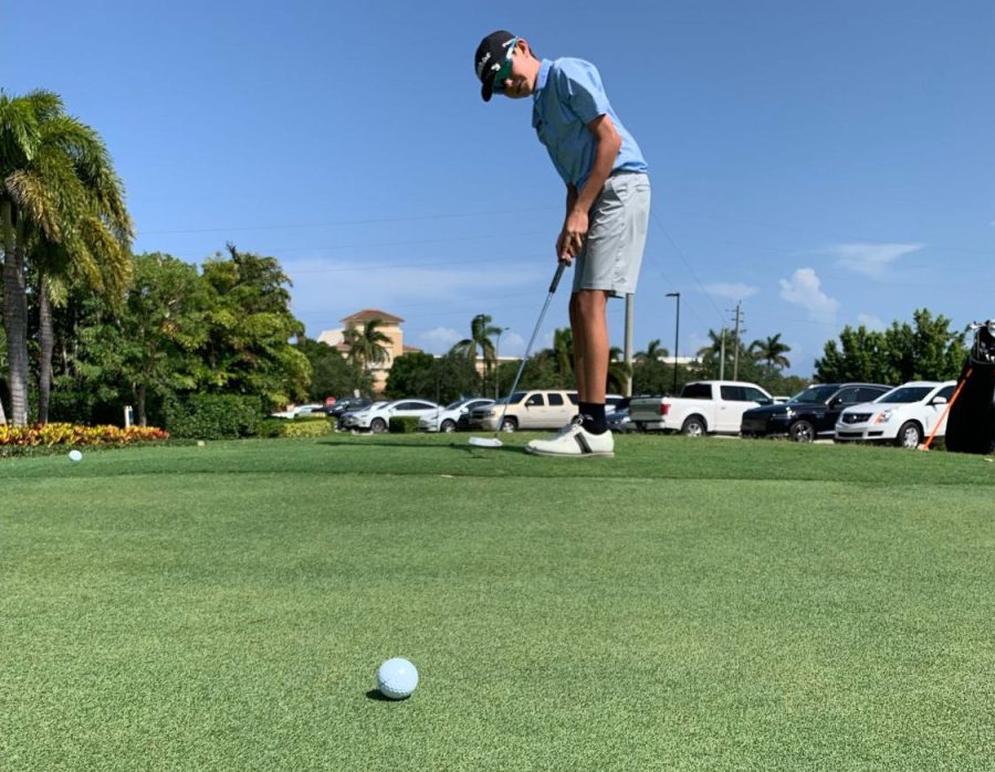 Seventh+grader+Nicholas+Zaccagnino+attempts+a+putt+before+the+tryouts.
