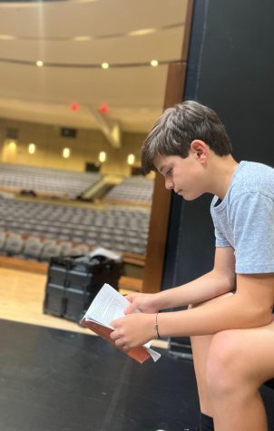 Harrison Poulakakos reading his lines before a practice.