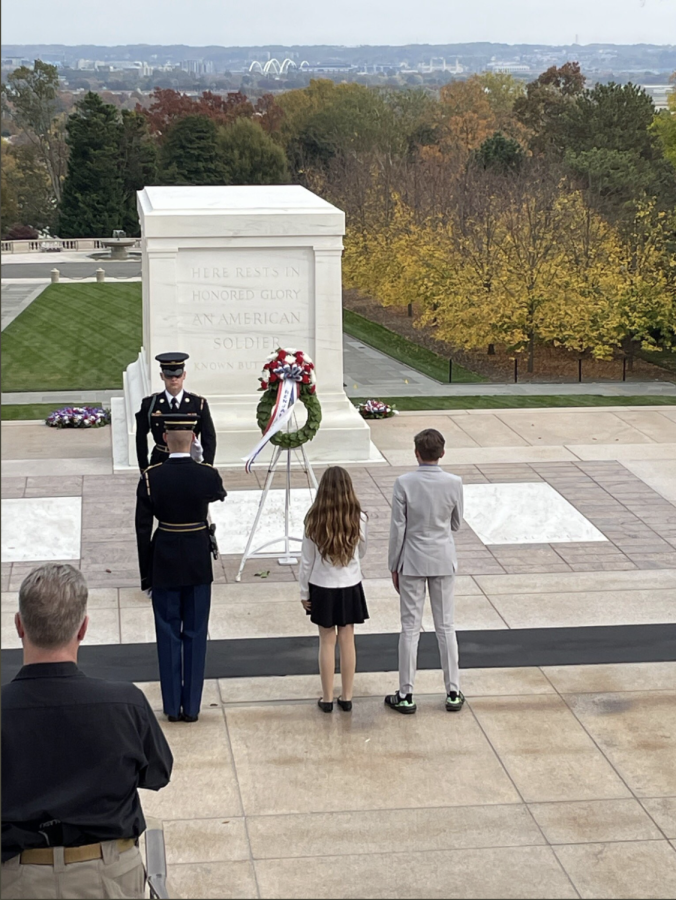 Students Elizabeth Merill and Thomas Harris participate in a honorary wreath laying ceremony