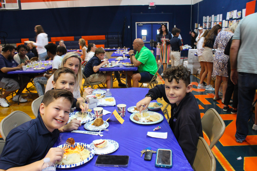 Sixth graders Lucas Yates and Nathan Crockett celebrate Heritage Day with a delicious lunch. 