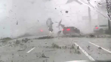 The tornado tossed a car into the air. 